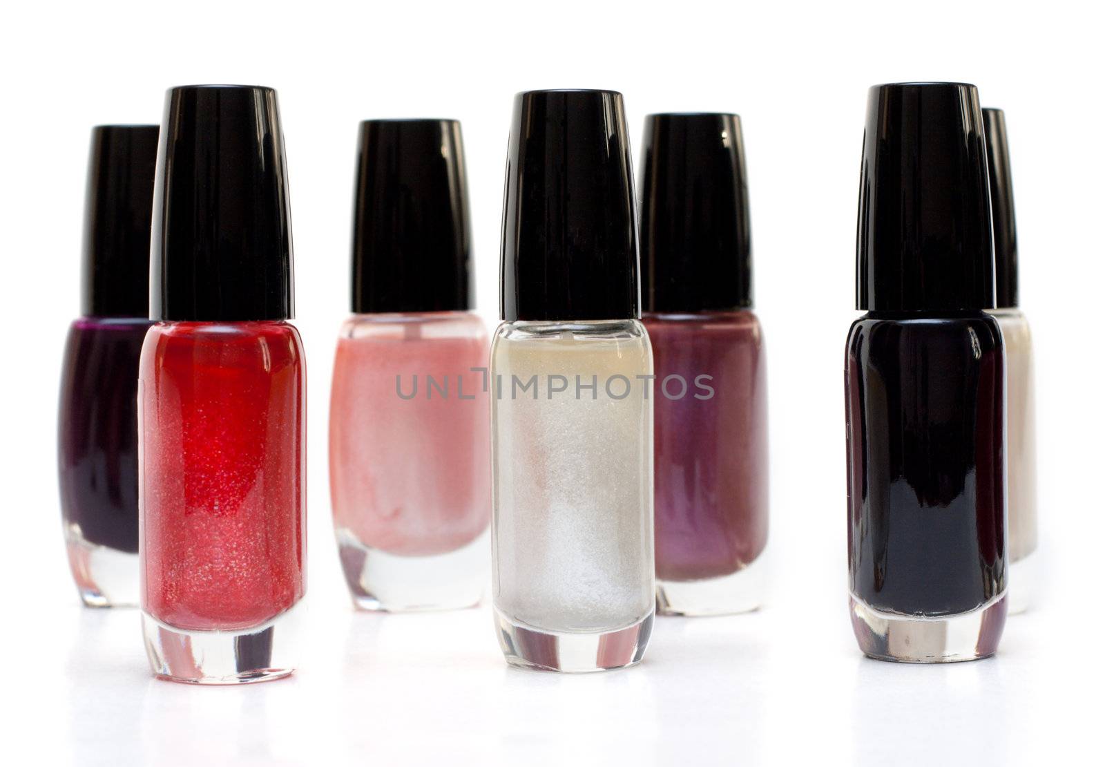 Vials colour varnish nailwaer, make-up insulated on white background