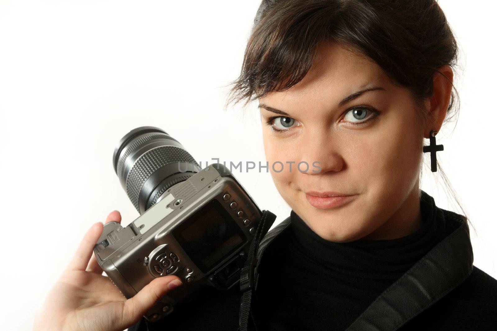 The beautiful girl with a camera on a white background