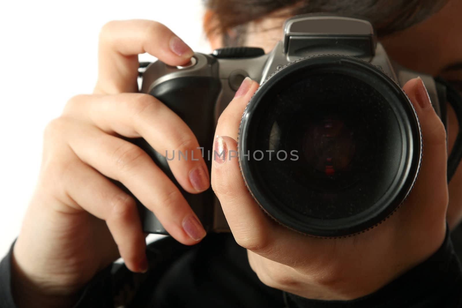 The beautiful girl with a camera on a white background