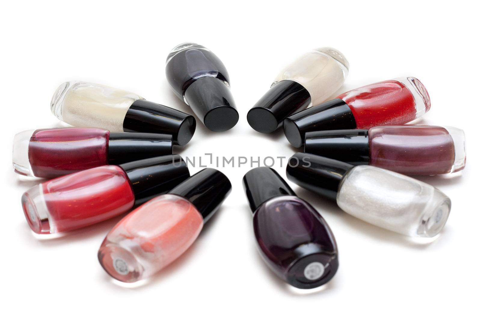 Vials colour varnish nailwaer, make-up insulated on white background