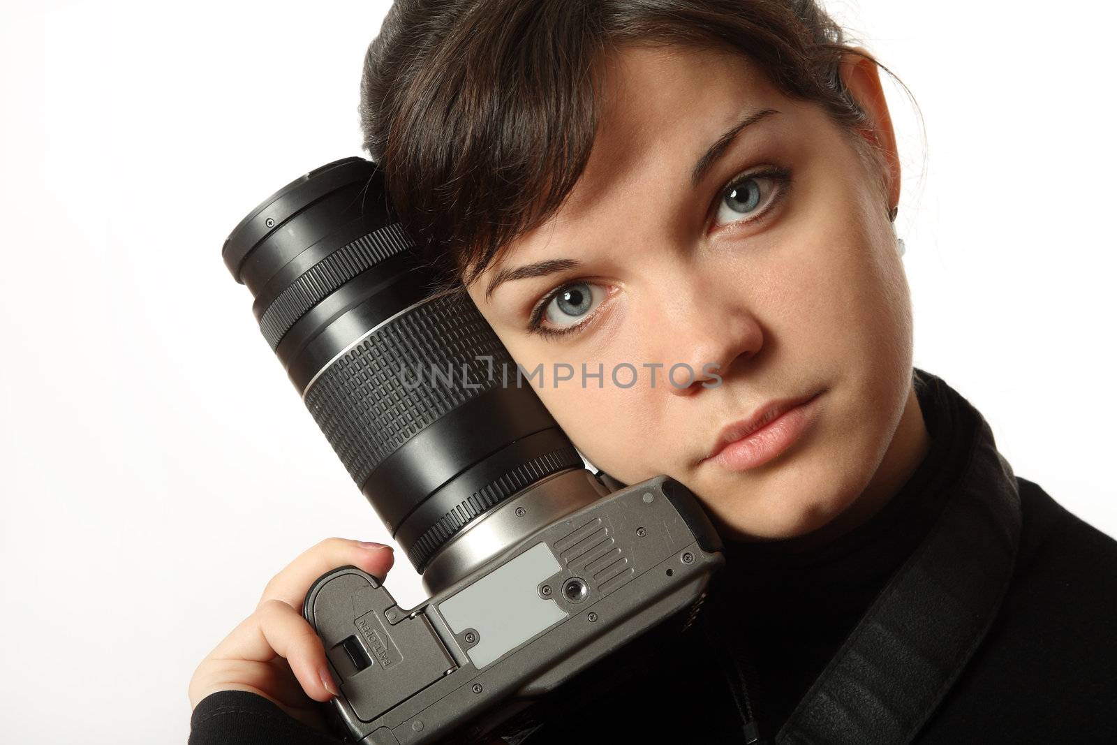 The beautiful girl with a camera on a white background