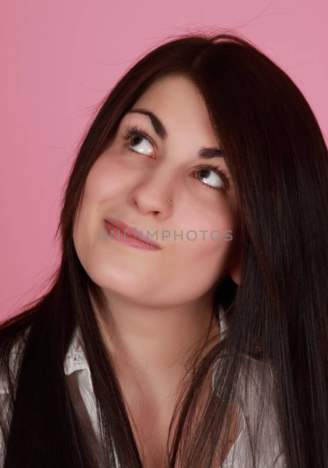 closeup portrait of caucasian girl, pink background