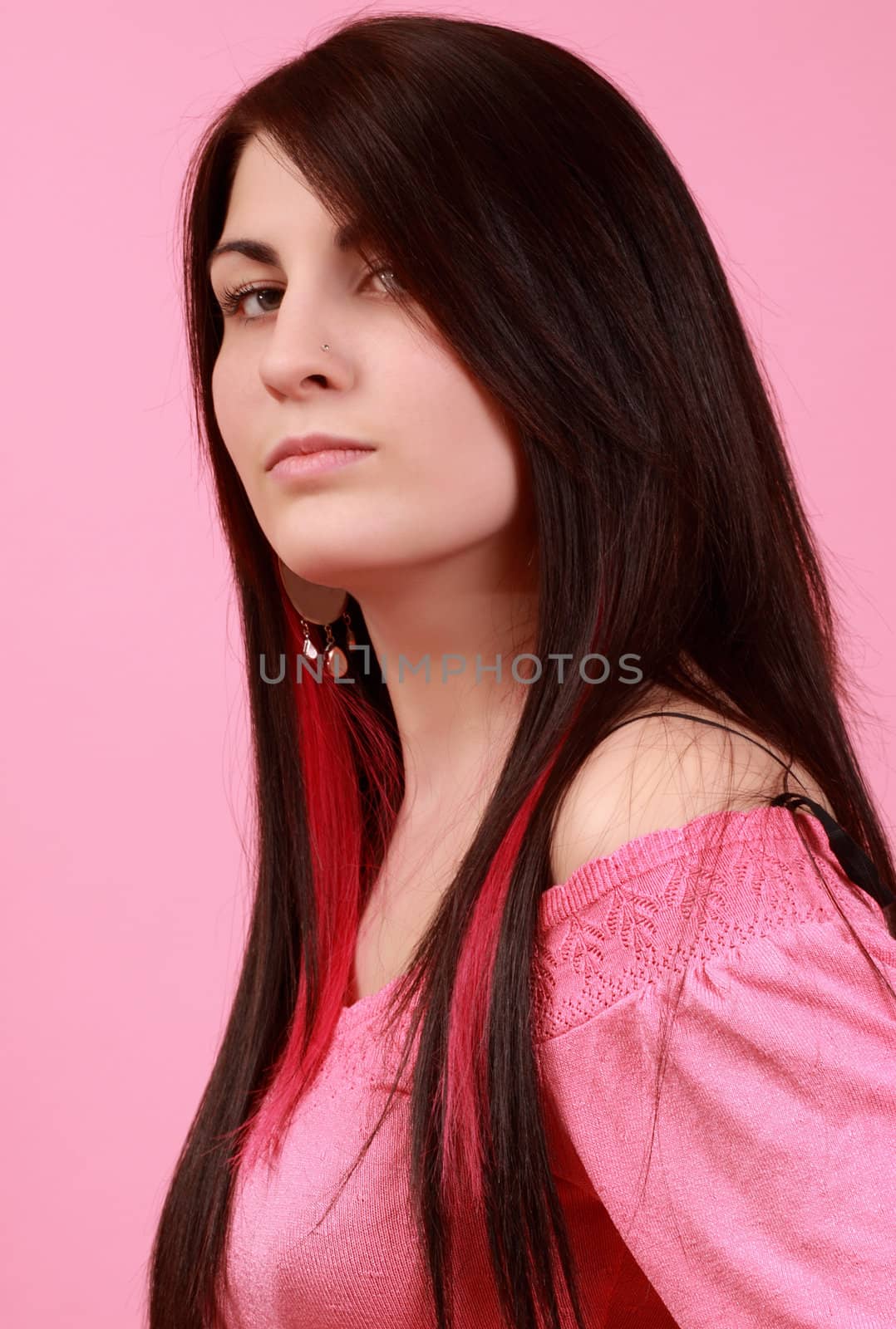 caucasian girl with long hair, pink background