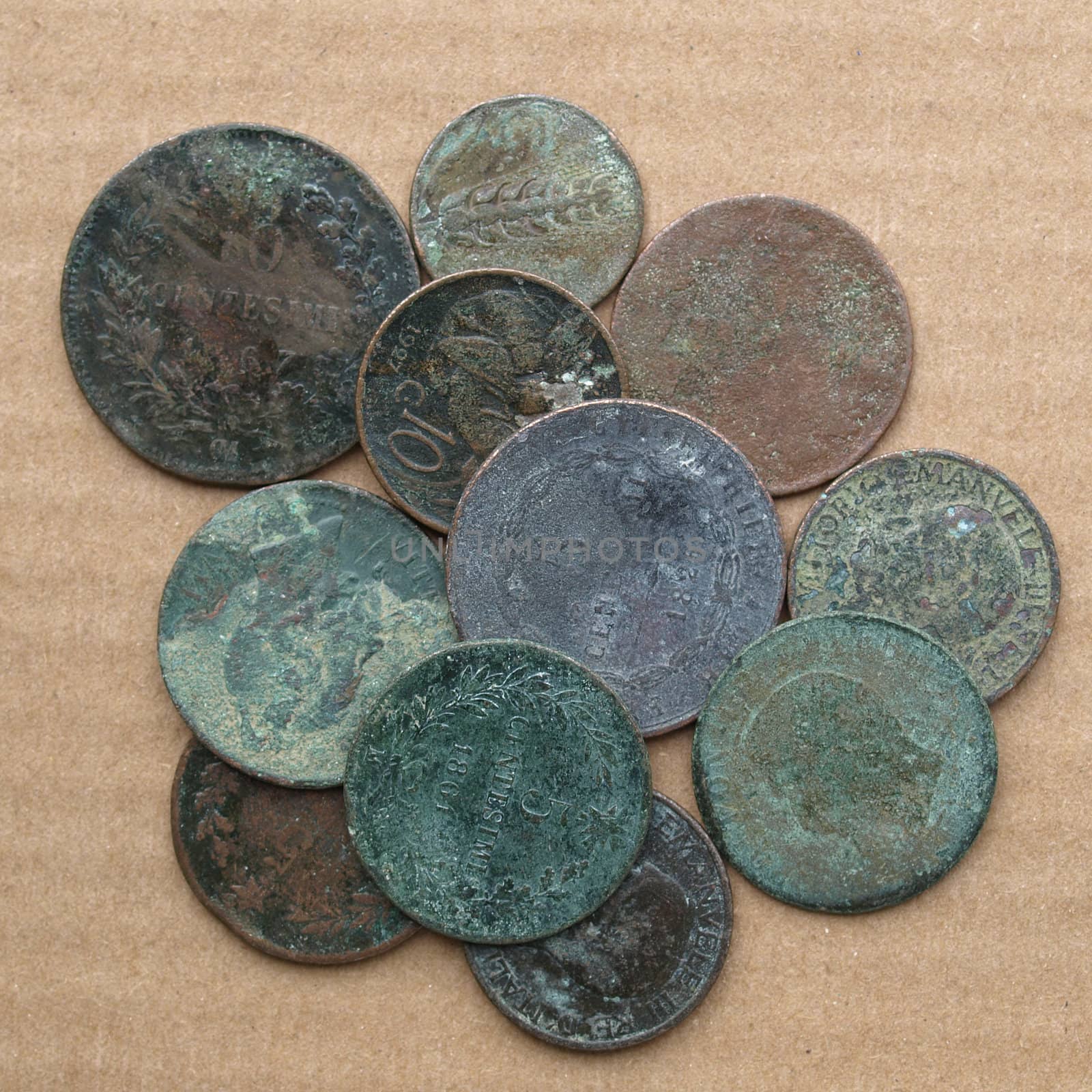 A heap of many ancient rusted coins