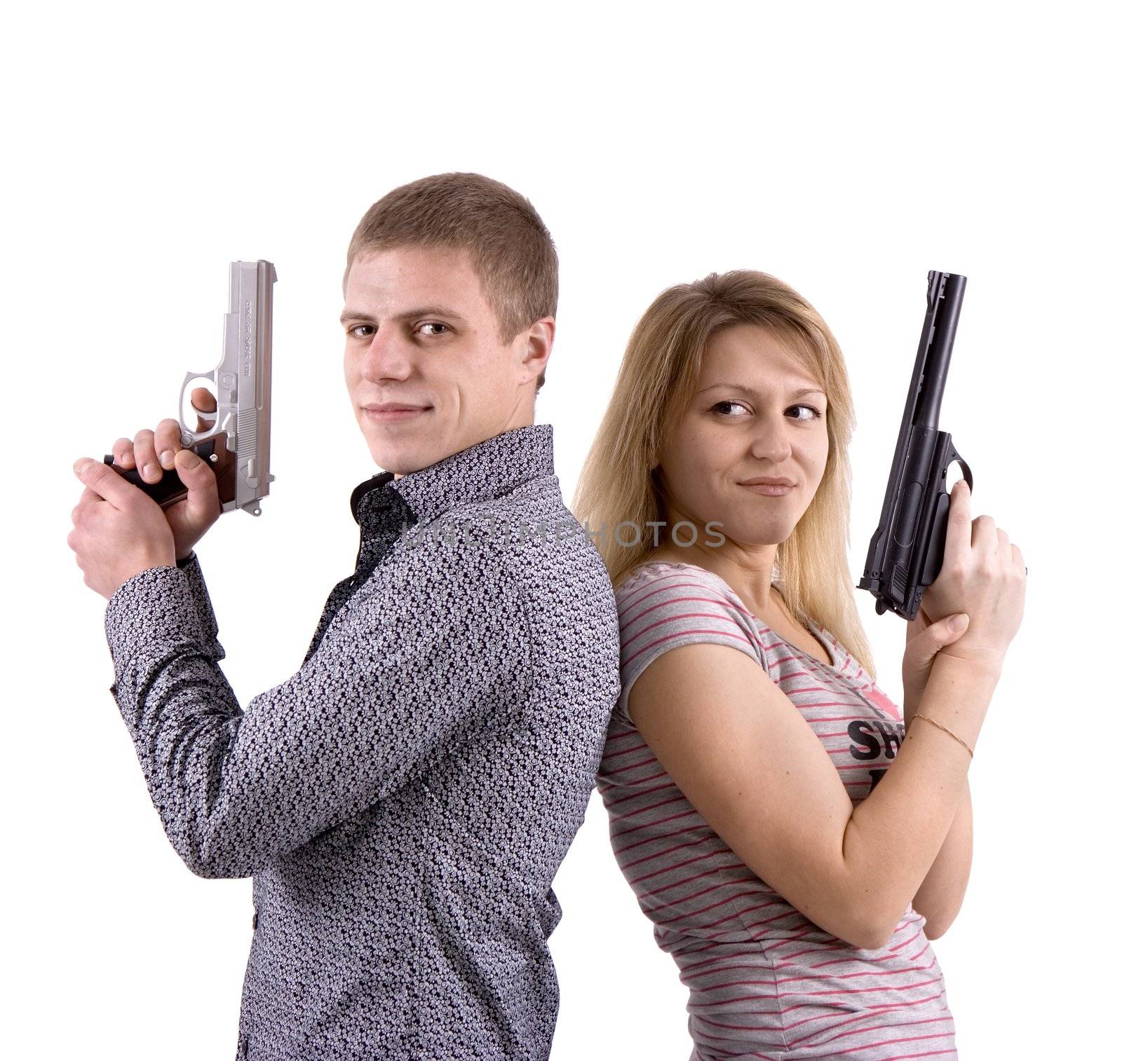 young man and woman standing back to back with the pistols in their hands