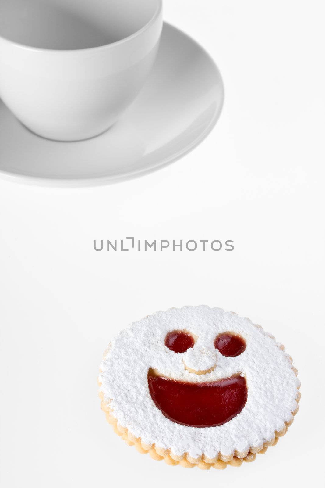 smiling cookie and a coffee cup isolated on white background