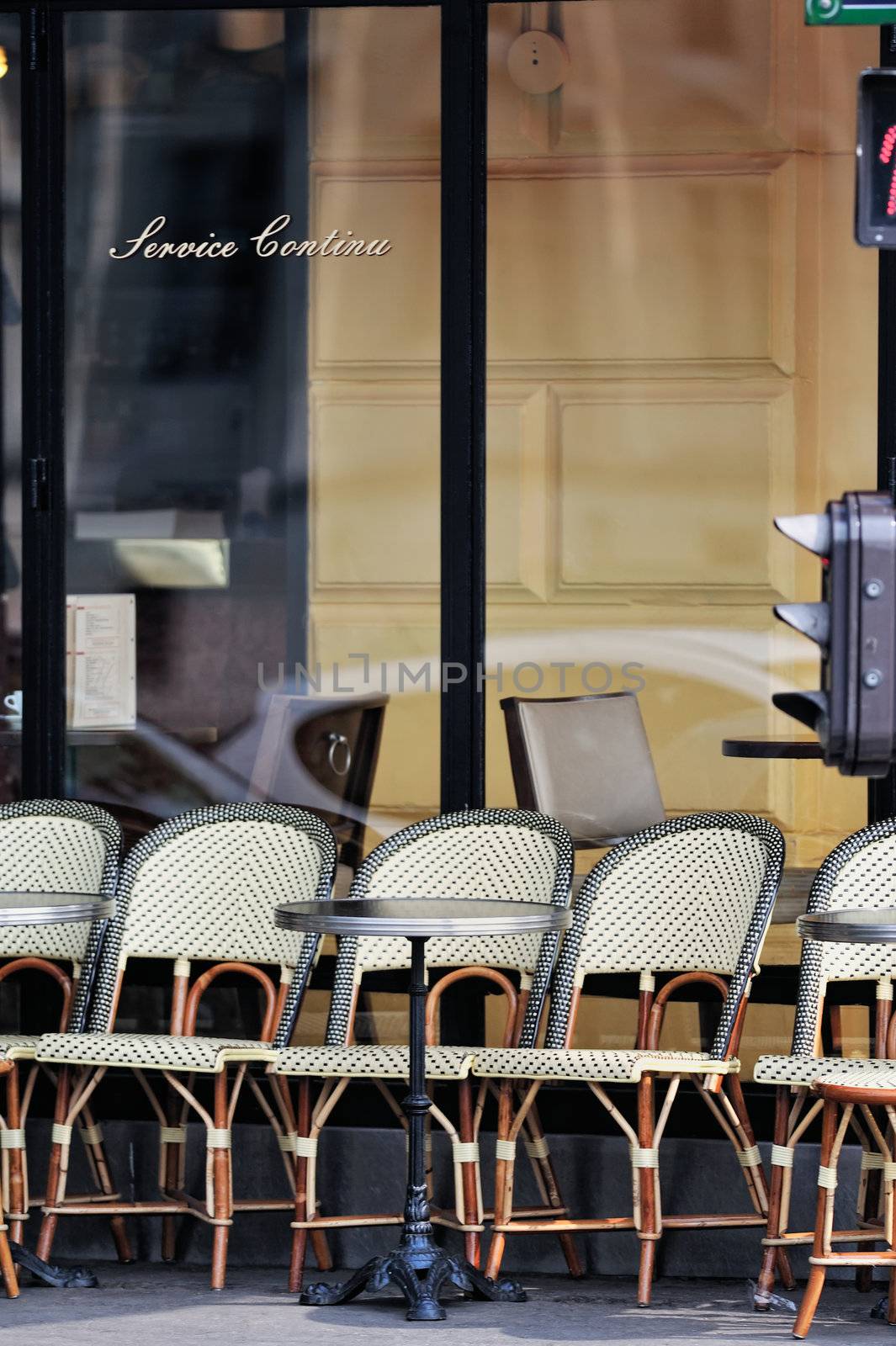 Wicker chairs in cafe in Paris. Photo with tilt-shift effect