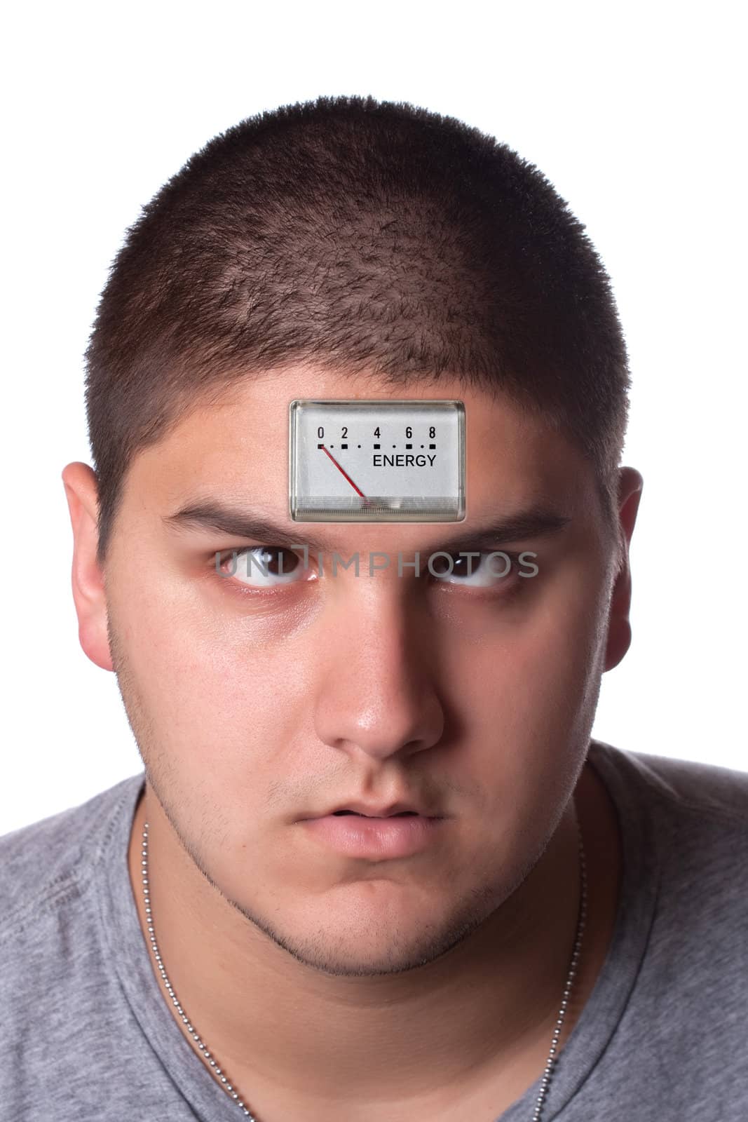 Conceptual image of a young man with a low energy meter on his forehead to illustrate tiredness.