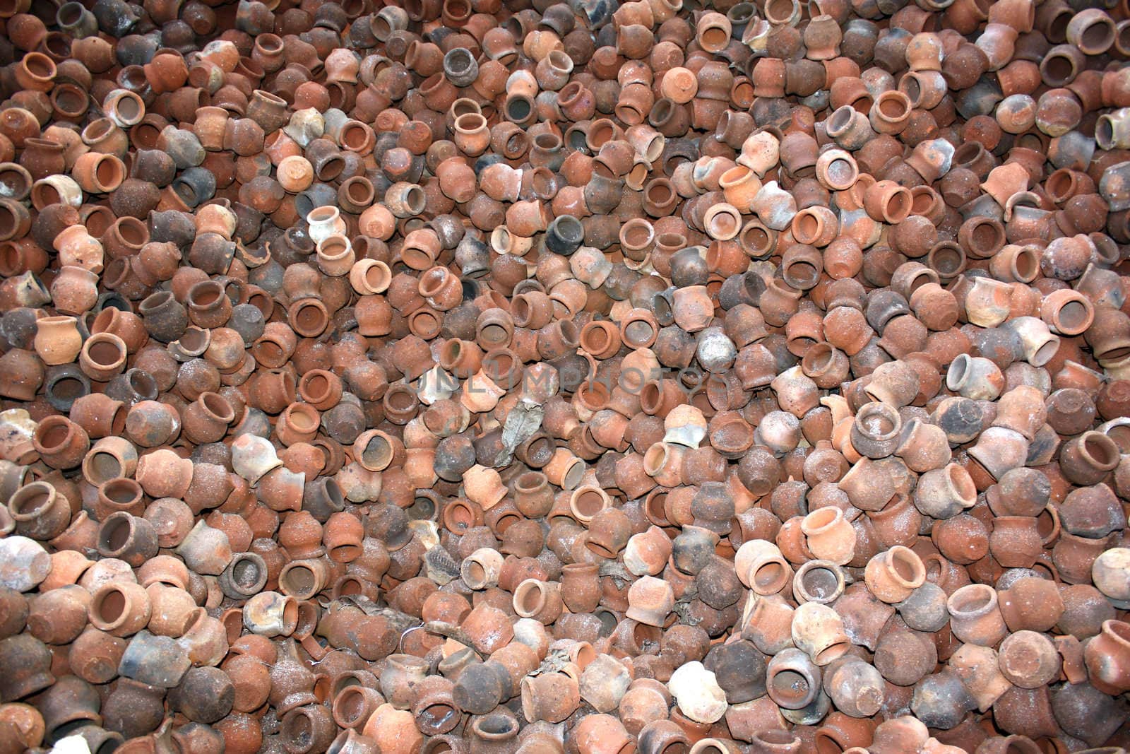 A background of red clay pots.