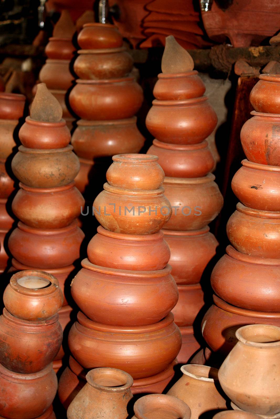 Different clay plots on display at a potters shop.