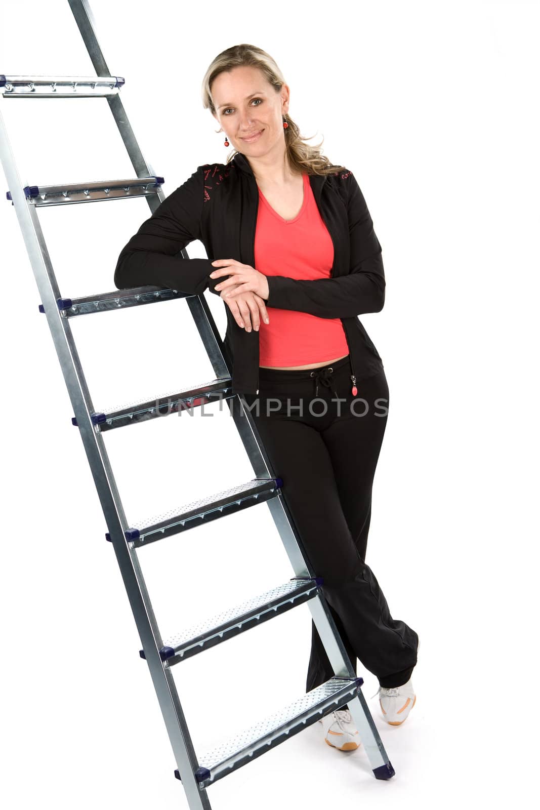 Young women with sportswear on ladder. White background