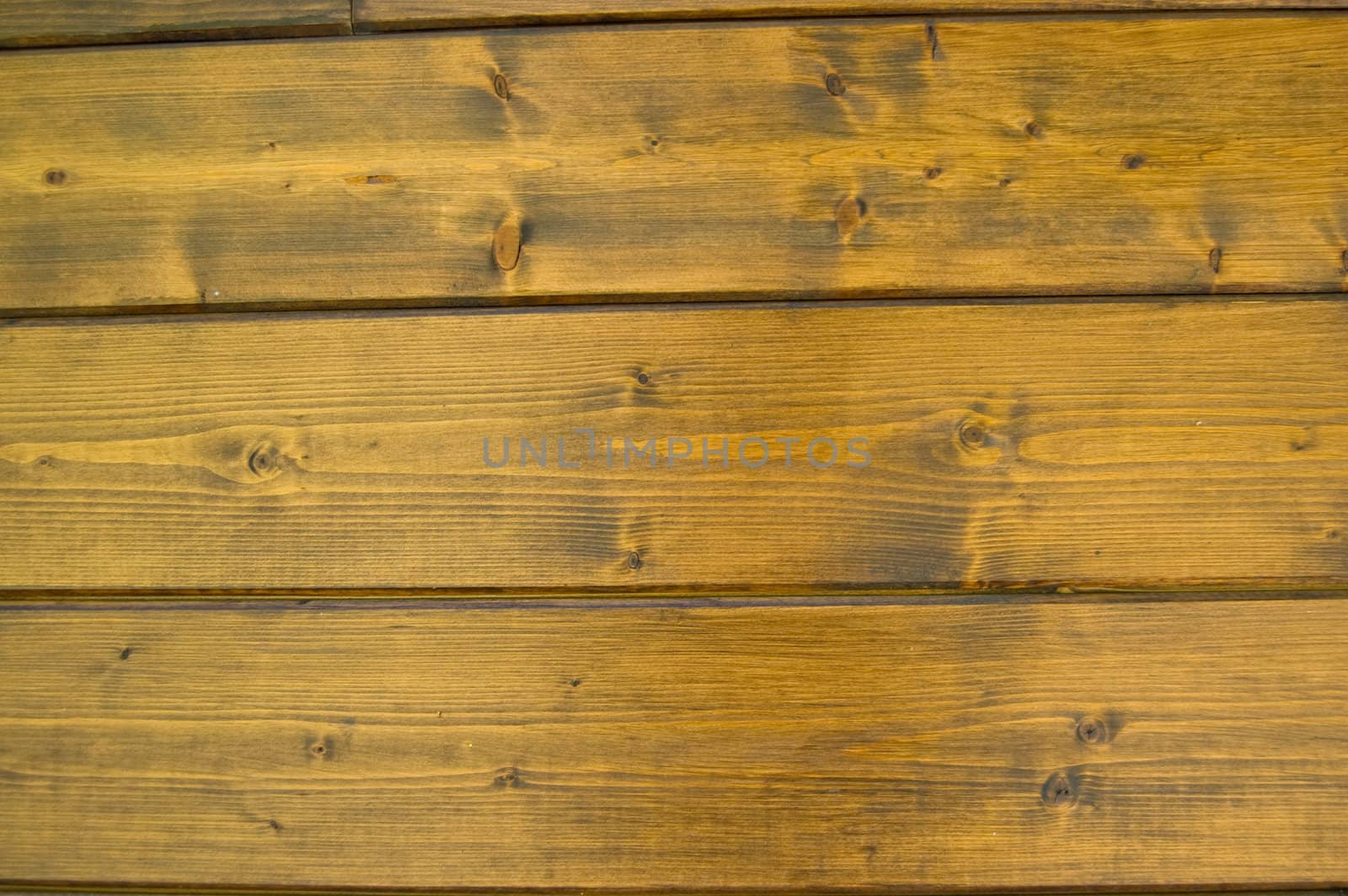 Facing of wooden boards of a wall. Detail of an alpine refuge side