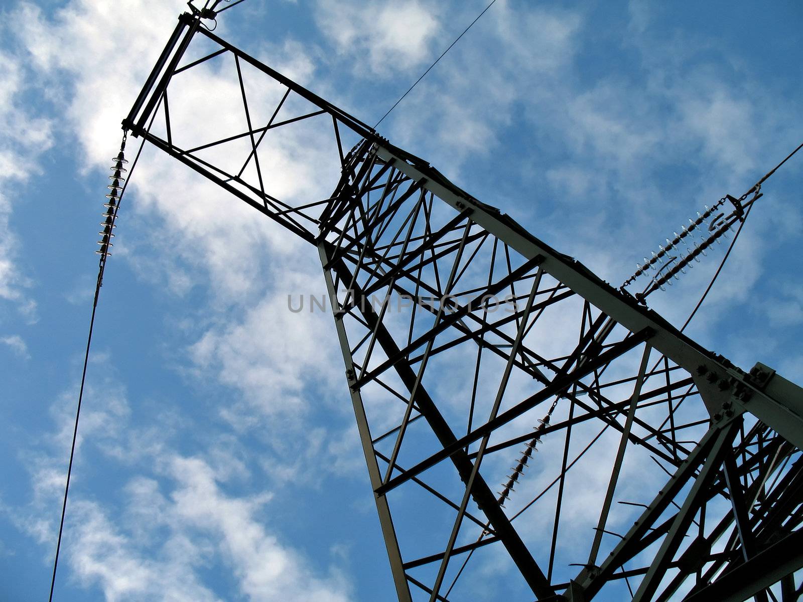 A silhouette of an hydroelectric high-voltage electrical line in mountain