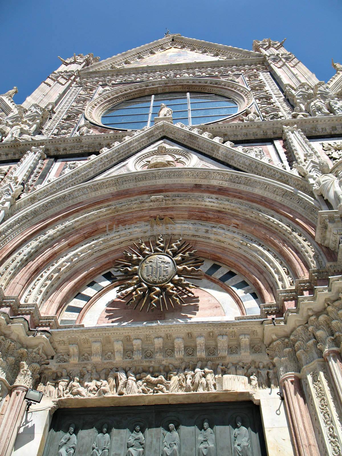The amazing view of the front of the Duomo in Siena (Santa Maria Assunta Cathedral), Tuscany, Italy.