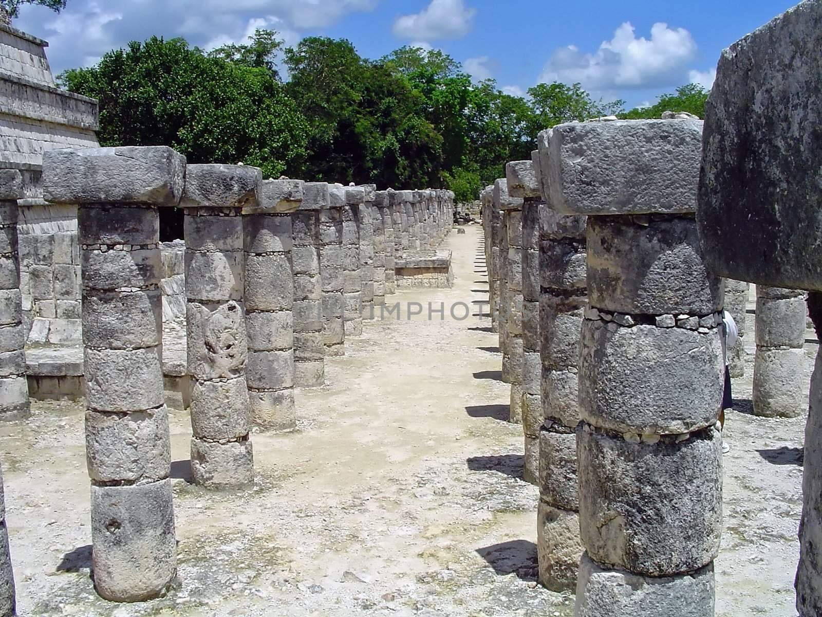 ruins of a colonnade in maya city chichen itza, Mexico