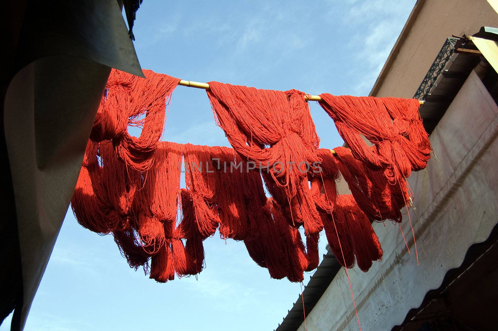 Red wool just tinted is drying in the souq of Marrakesh