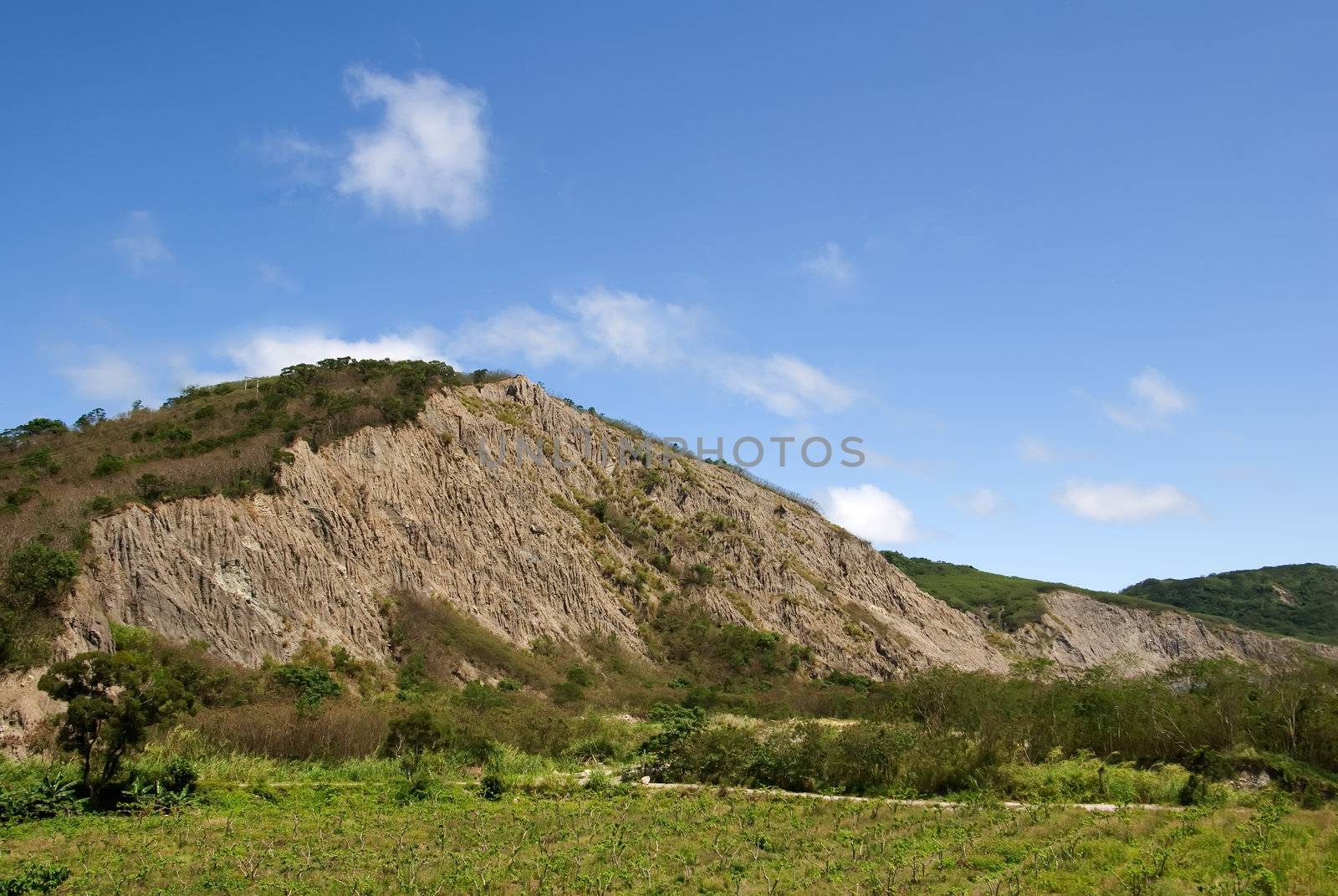 It is a dangerous mountain with blue sky.