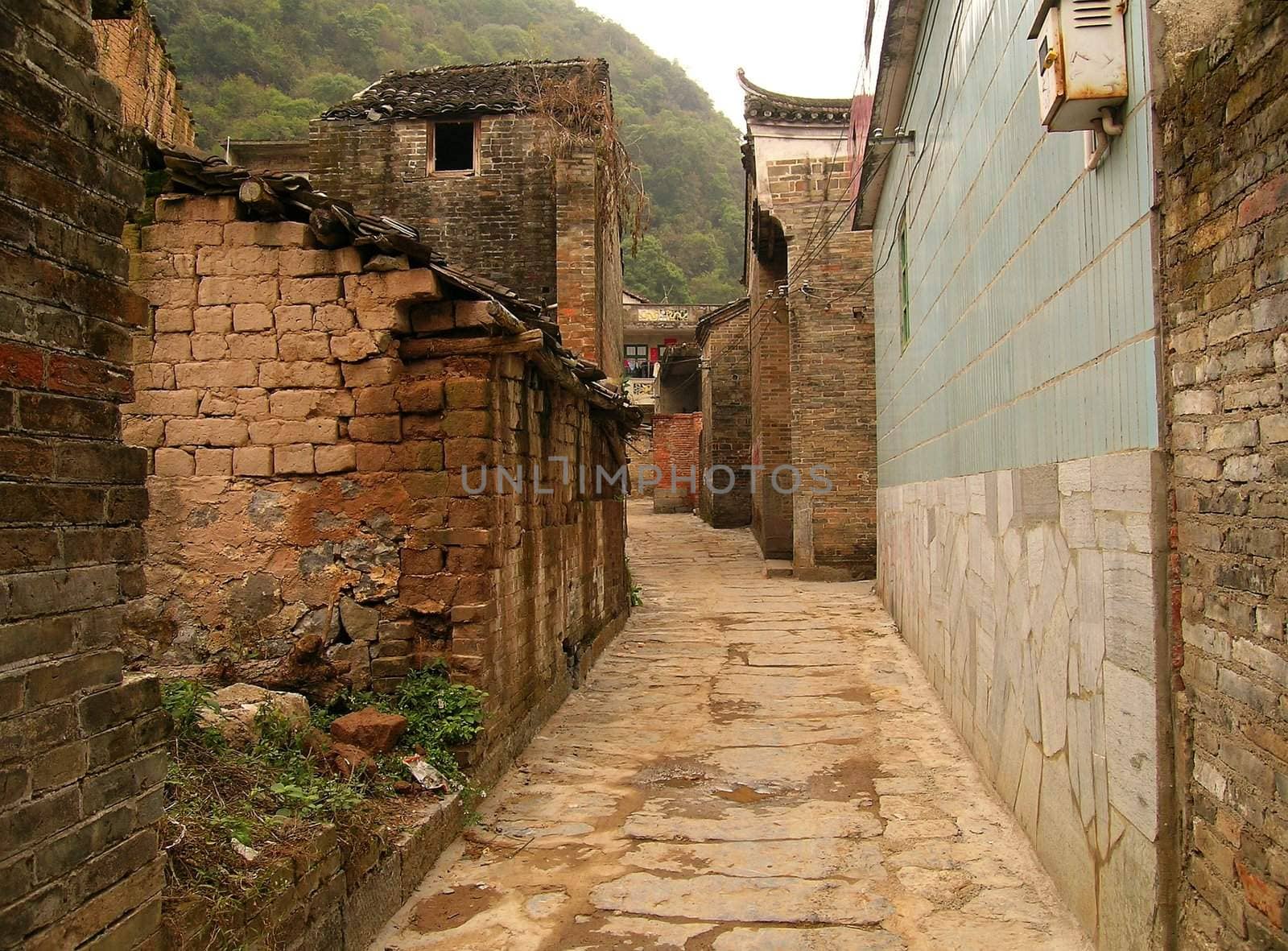 empty, narrow street in a small village