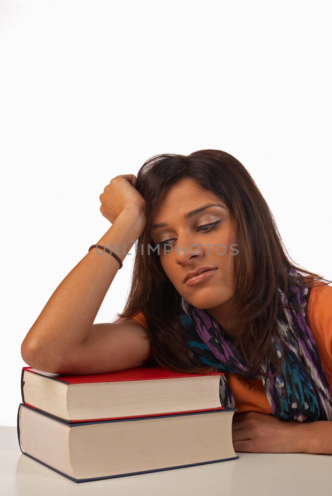 Middle eastern student in an uninterested attitude towards her books