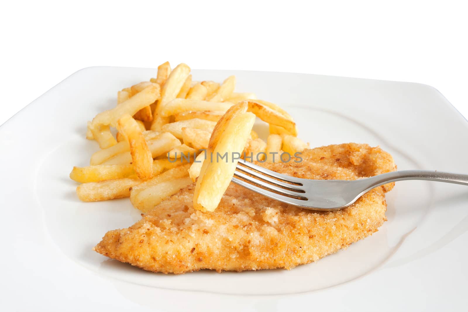 detail of fried potatoes and chicken with fork isolated on white background