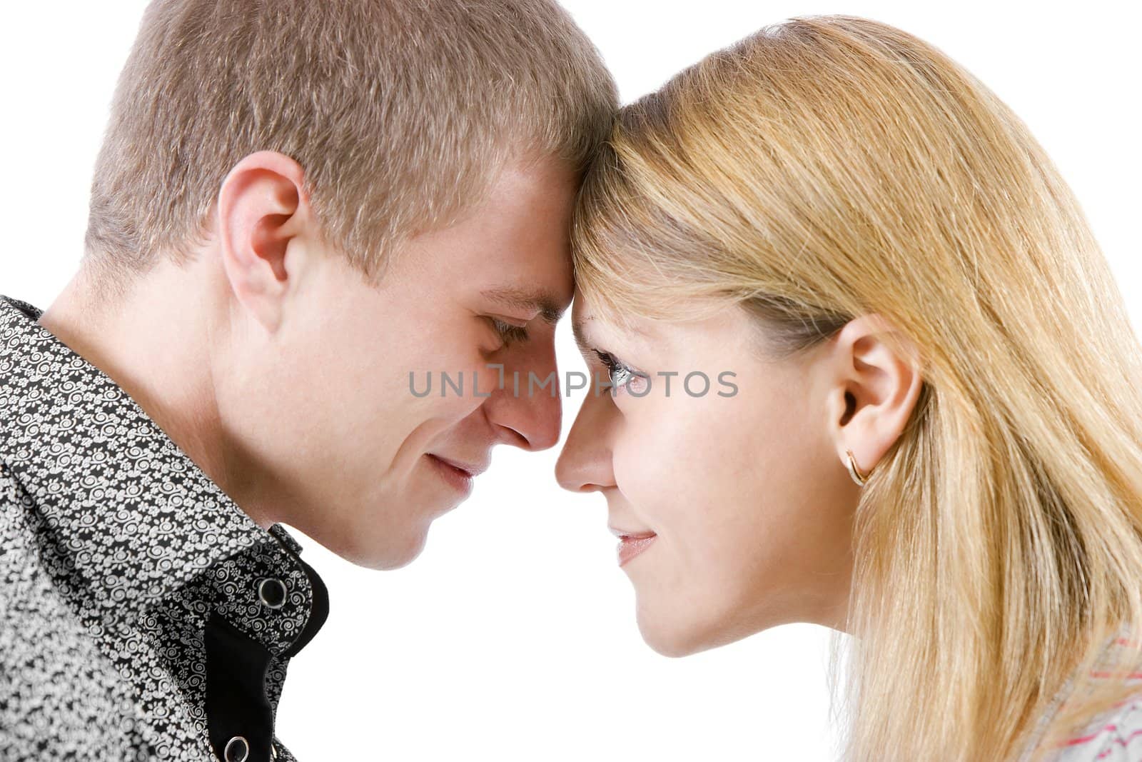 portrait of a young couple. They pressed their foreheads and smiling