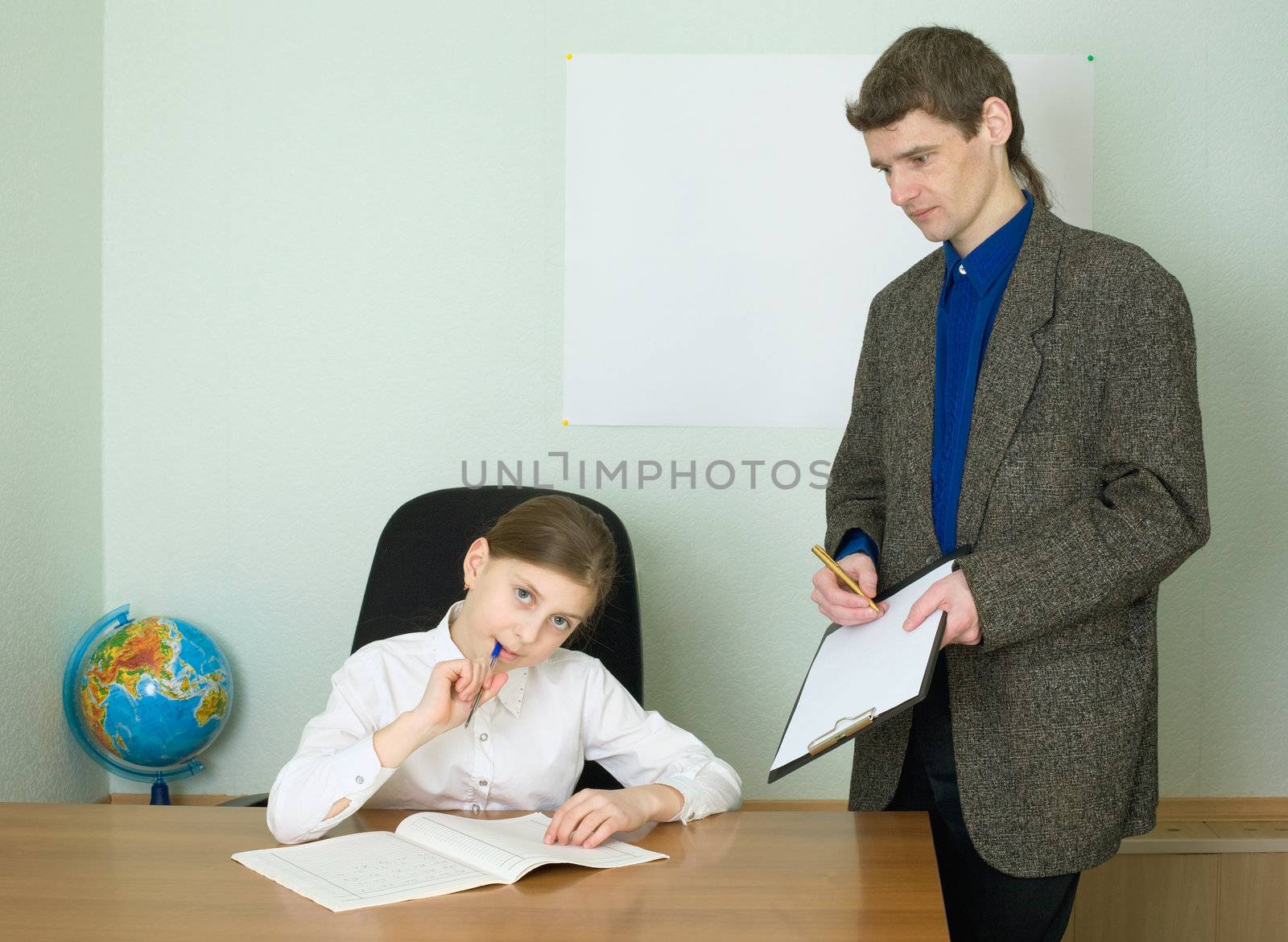 Teacher in a suit and girl with tablet