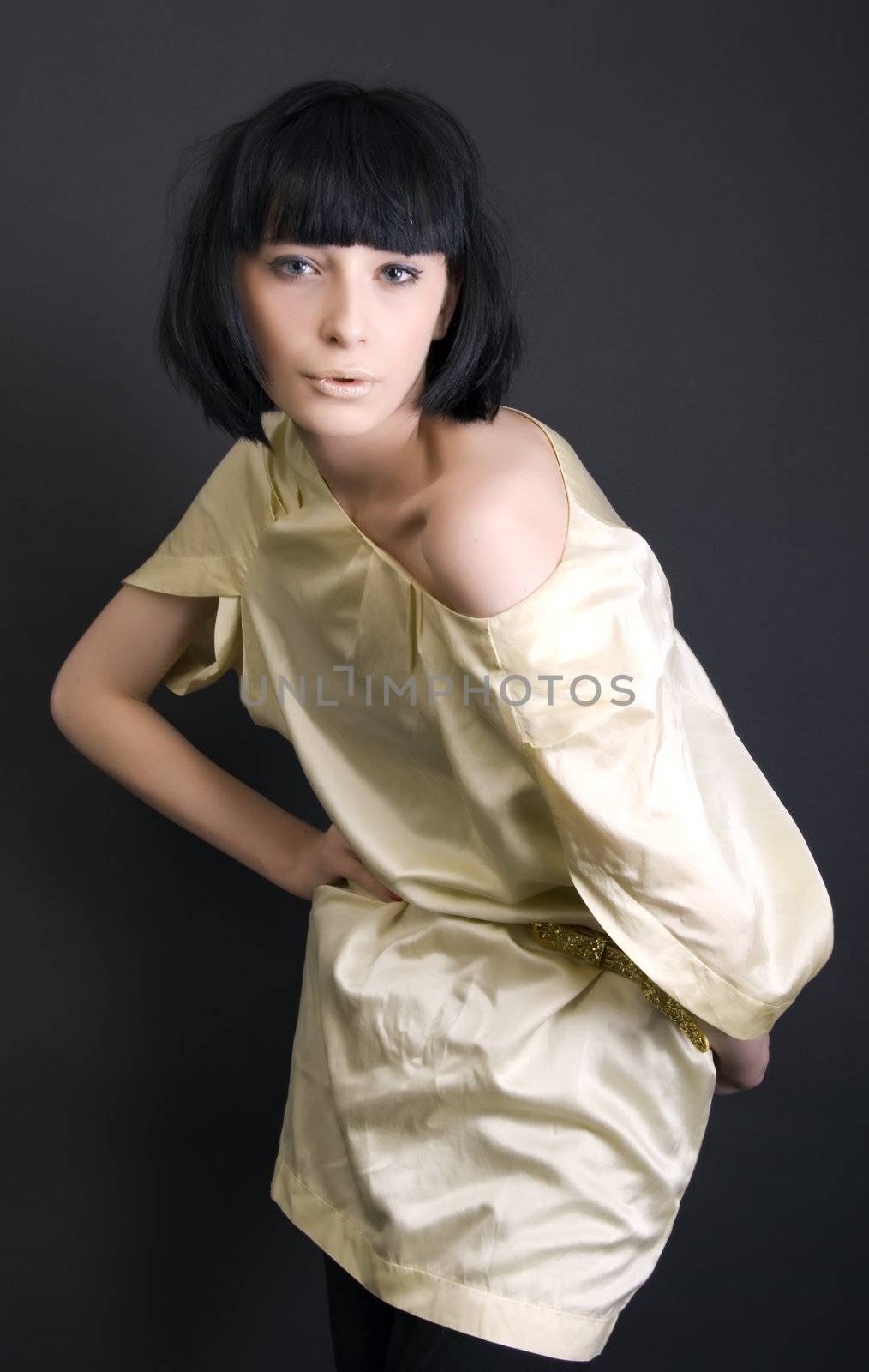 Portrait of a young beautiful fashionable brunette posing 