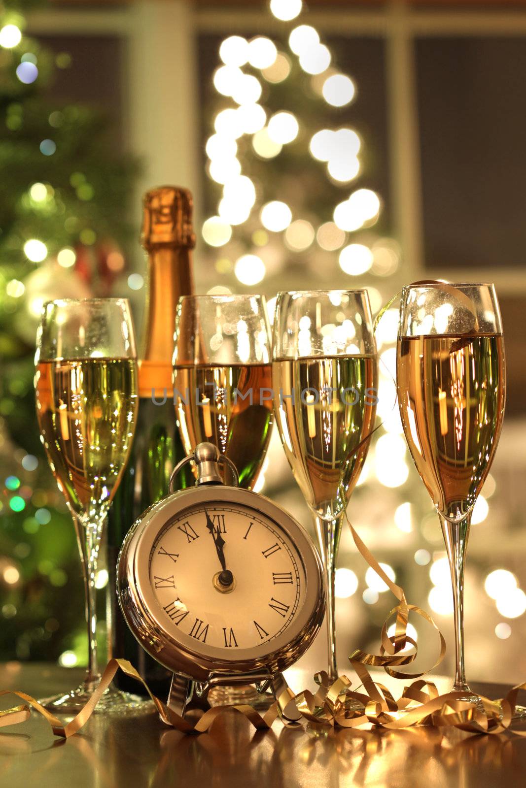 Four glasses of champagne ready for the countdown to the New Year