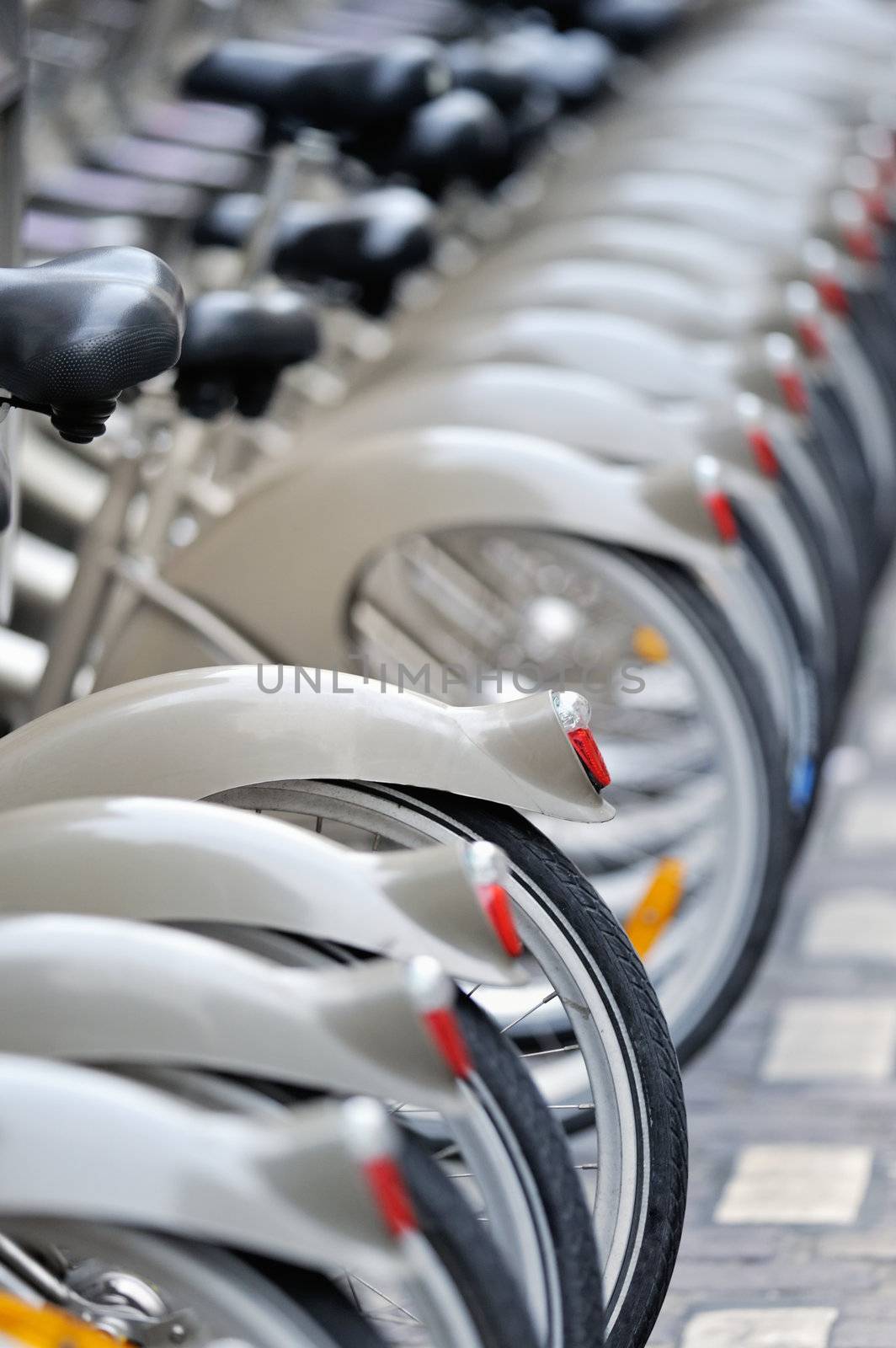 Group of bicycles in the row. Photo with tilt-shift lens