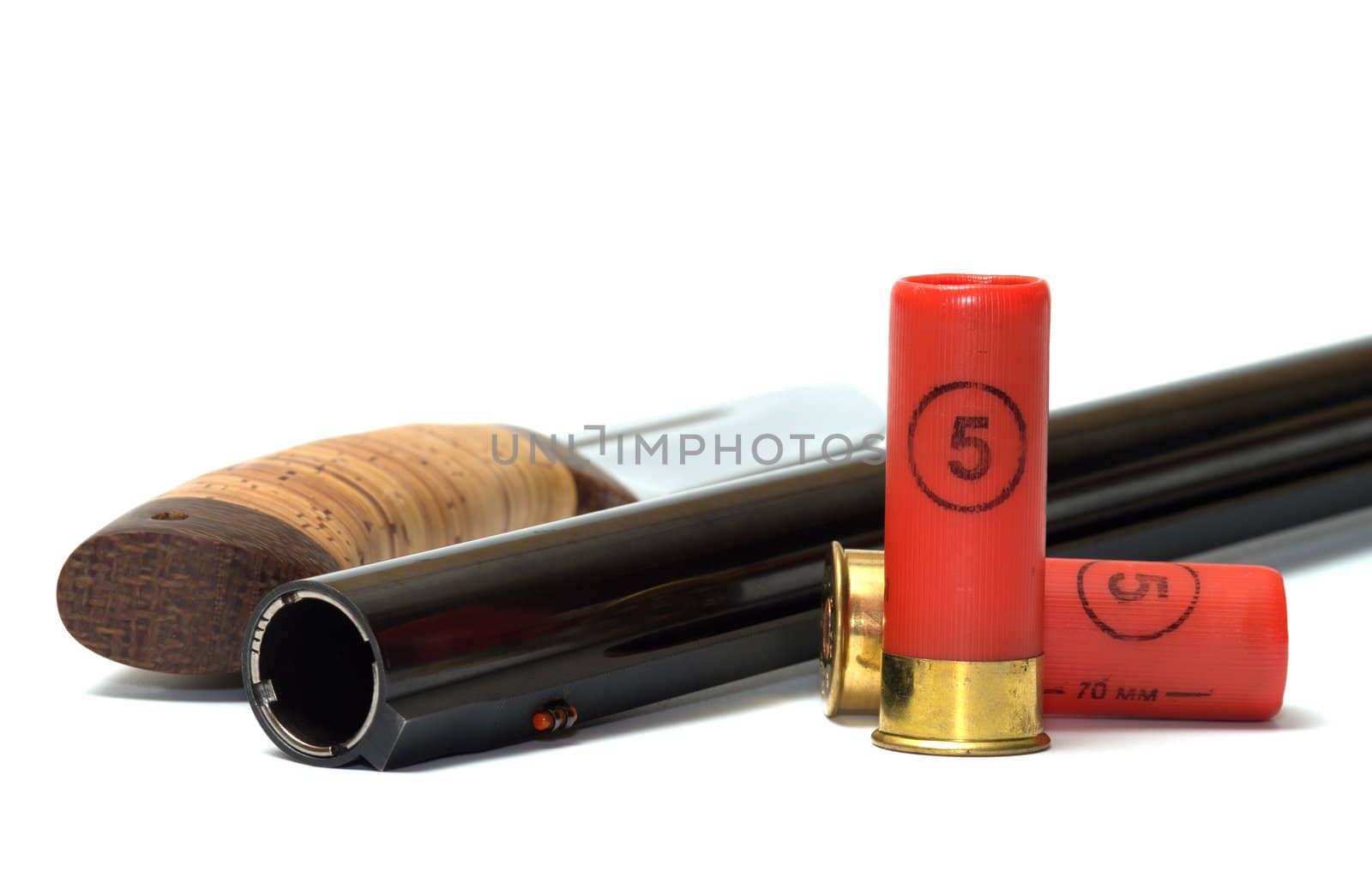 Barrel shotgun and cartridges knife on a white background.