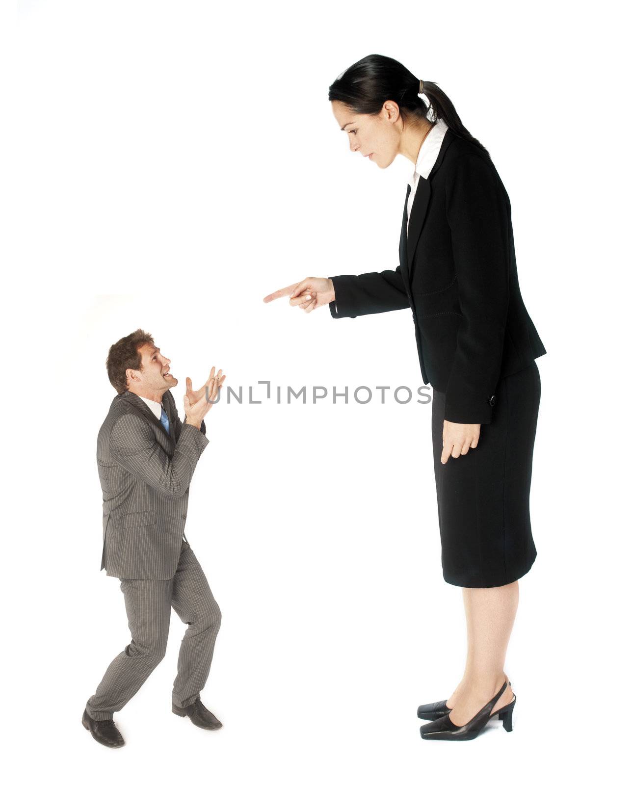 A business lady making a colleague feel small
