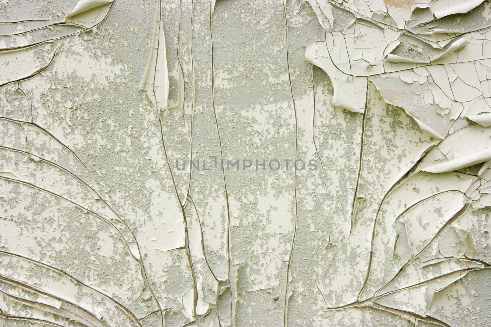 white and gray wall with old peeling paint
