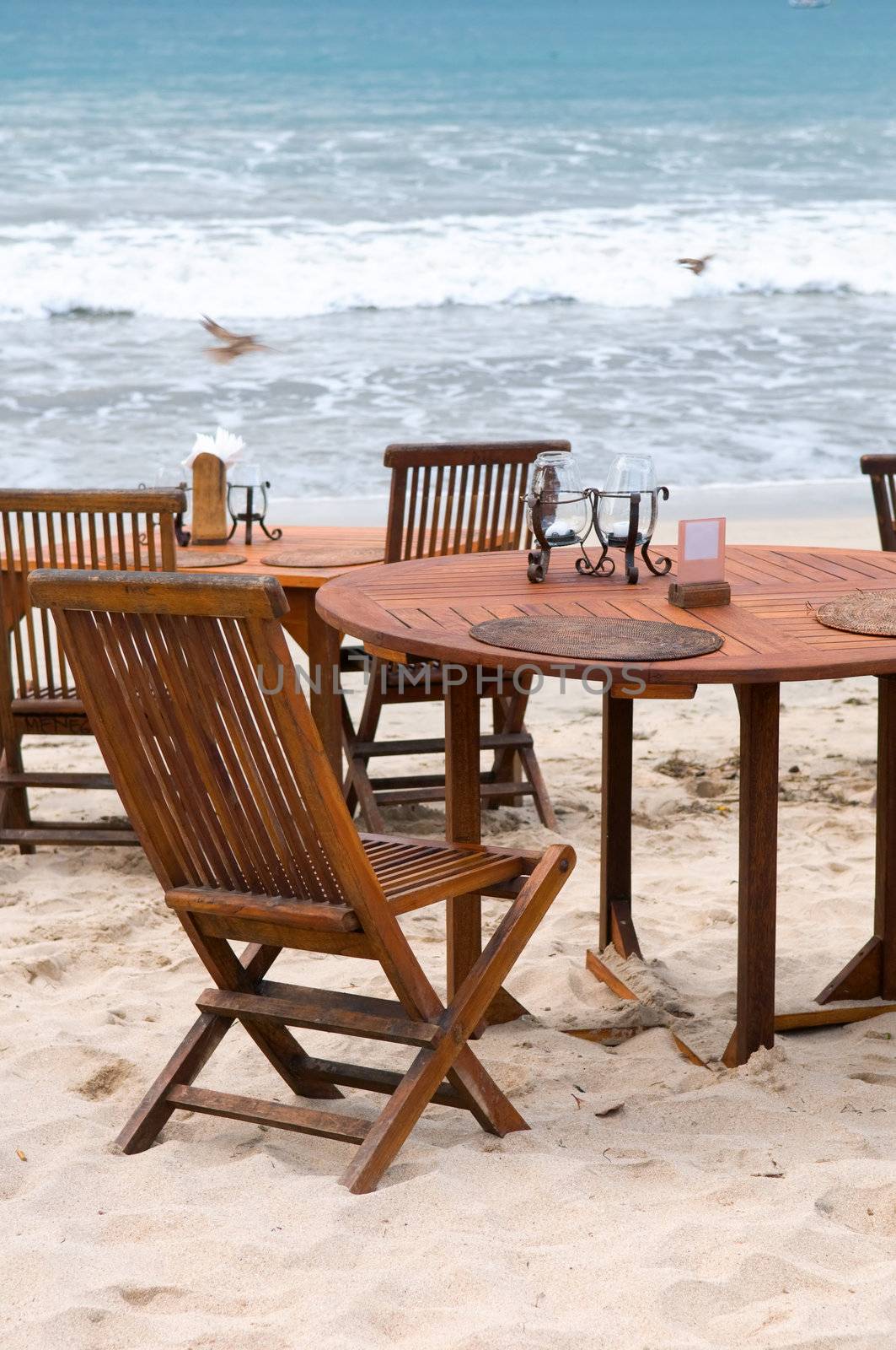 Table set at beach by tito