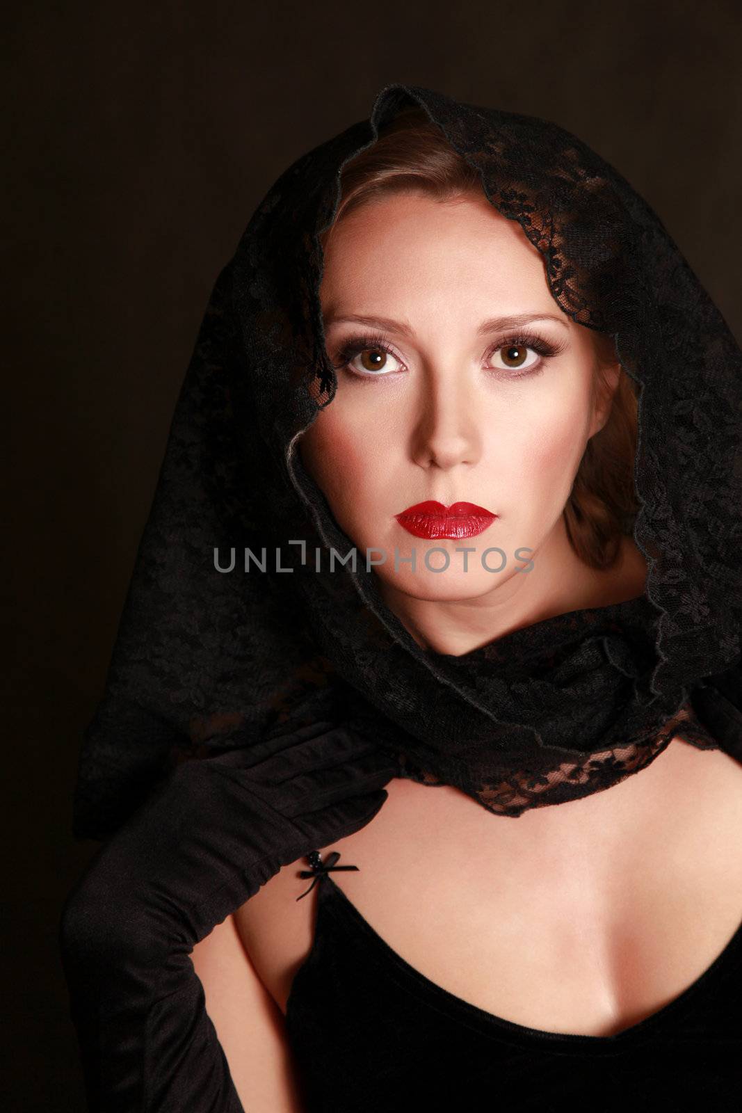 Beautiful woman closed by a black fabric