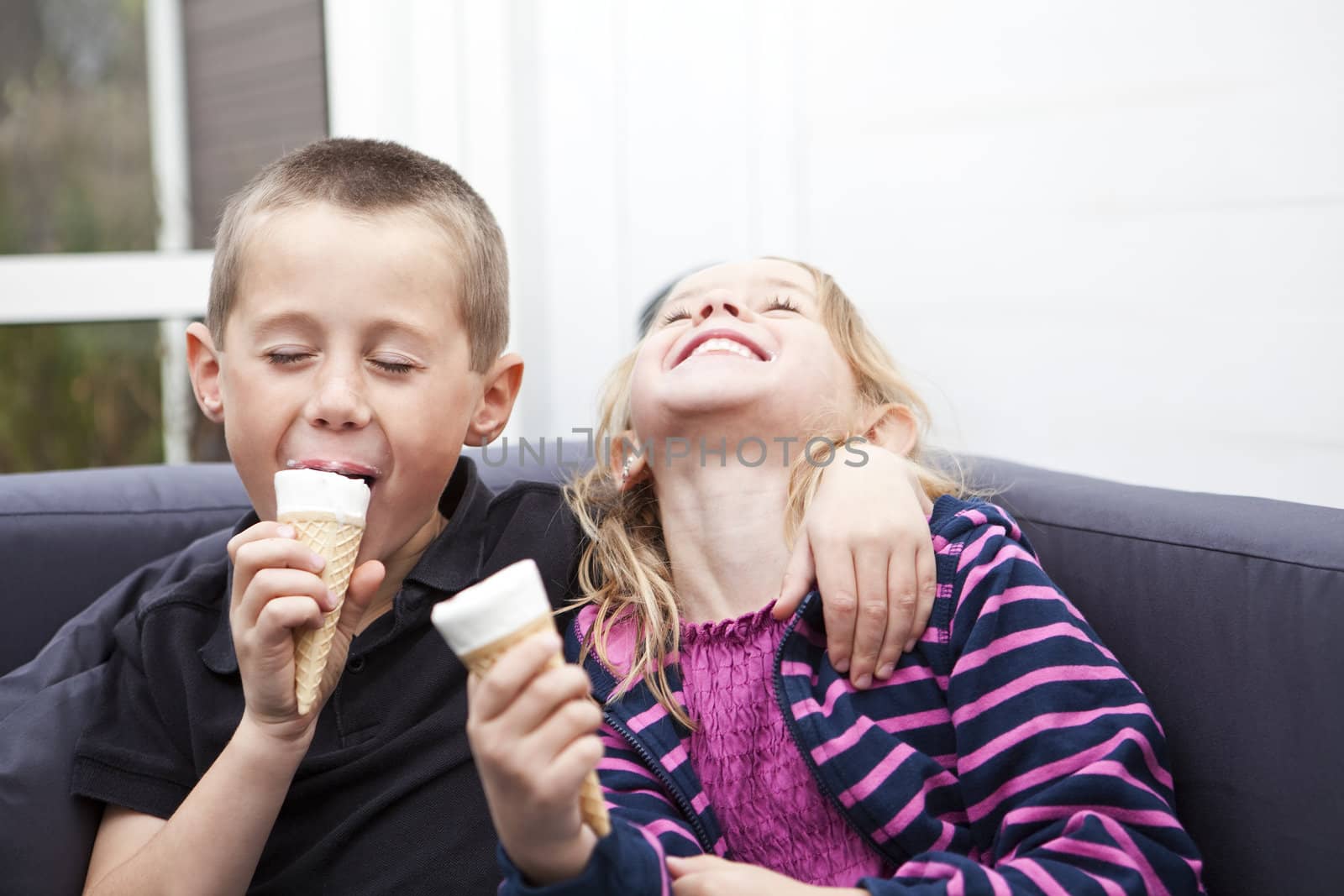 Happy Siblings eating ice-cream