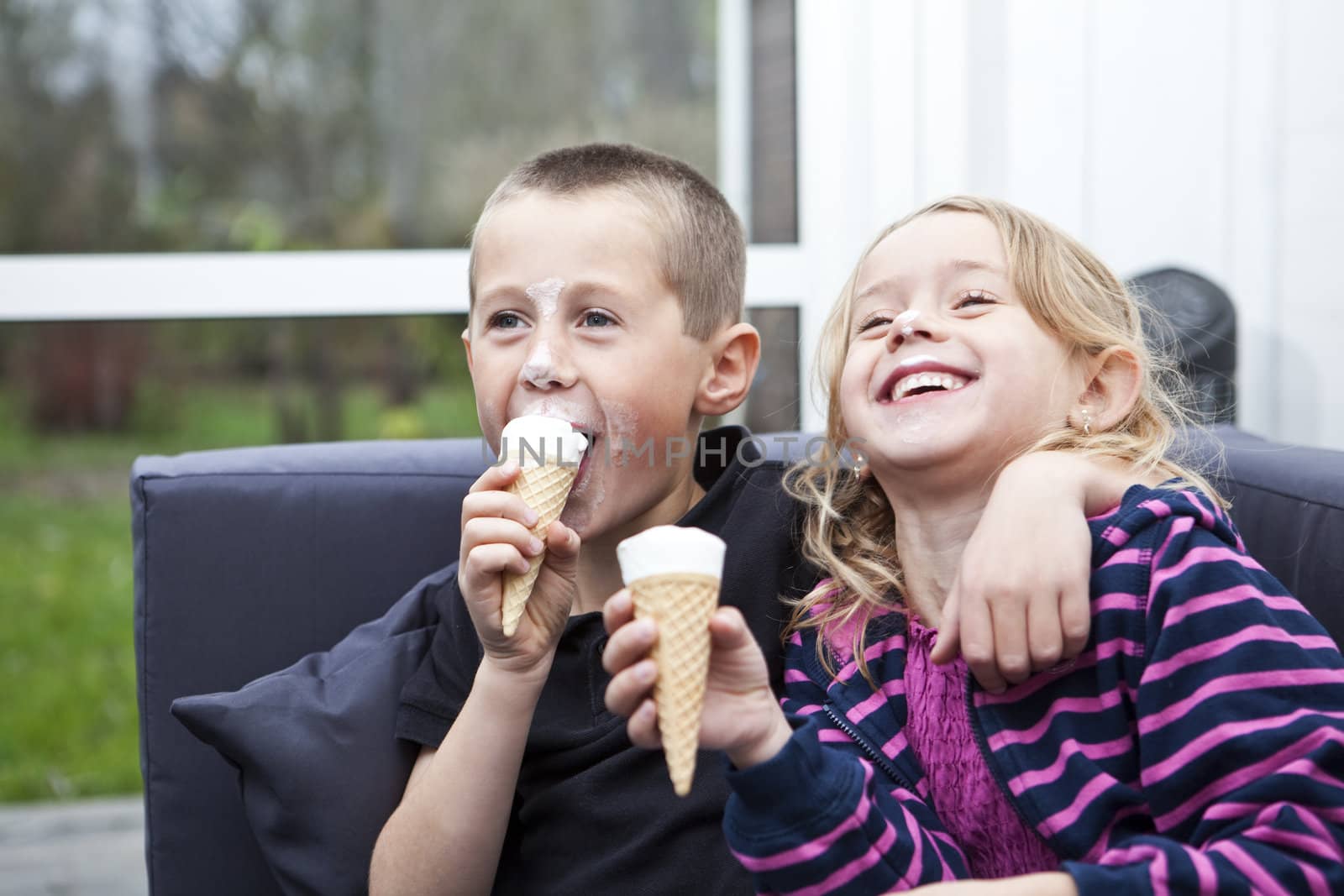 Happy Siblings eating ice-cream