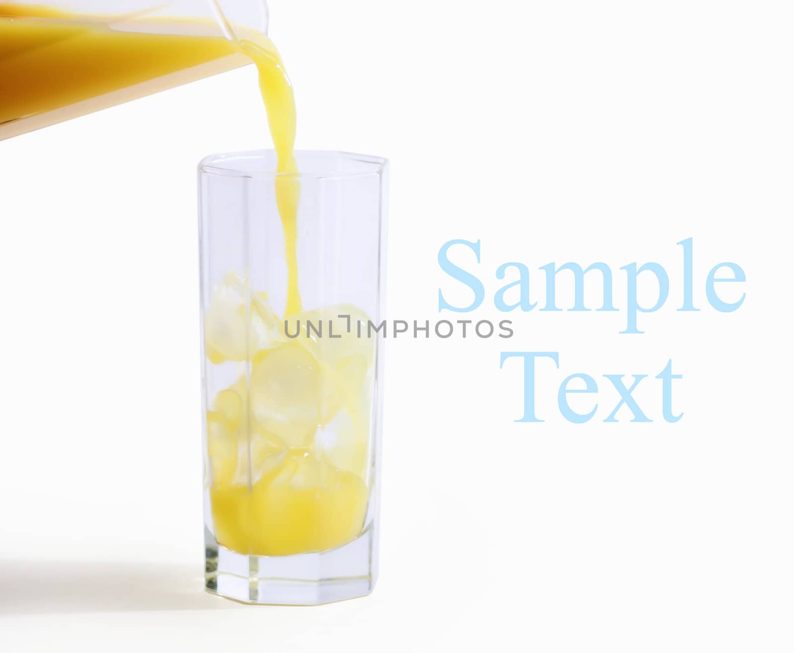 orange juce pouring in a glass on white background  with space for your text  - hand made clipping path included