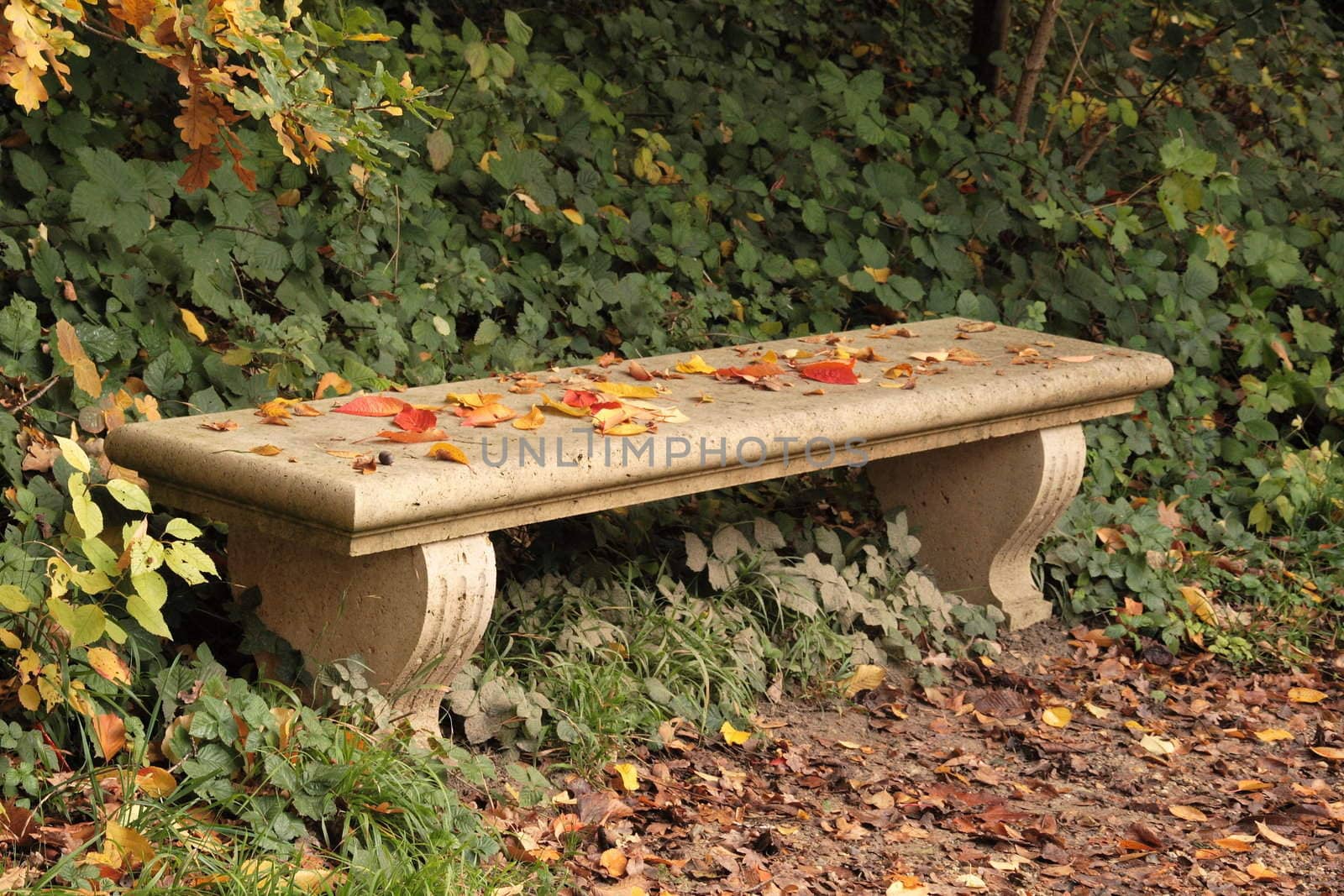 Bench covered with sheets in autumn