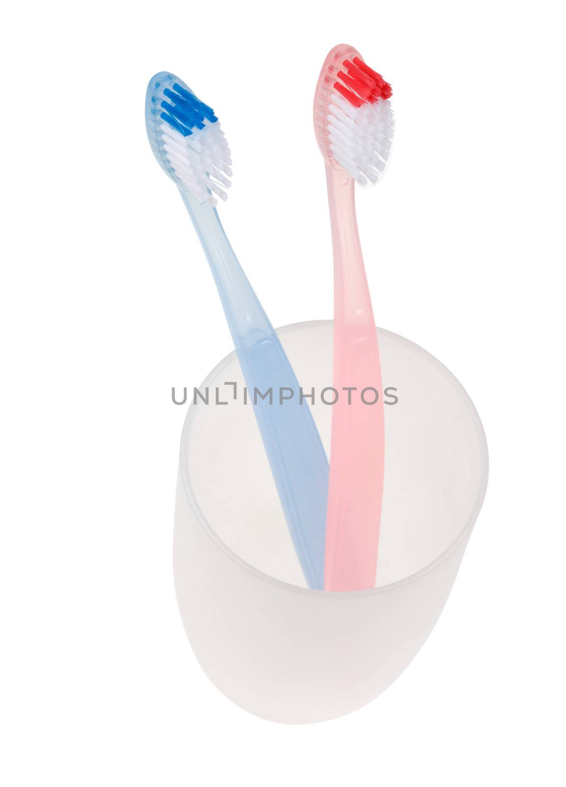 Colored toothbrush in glass. With clipping path.