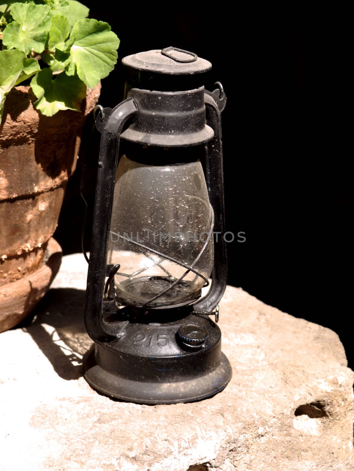 Old oil lamp standing on the staircase