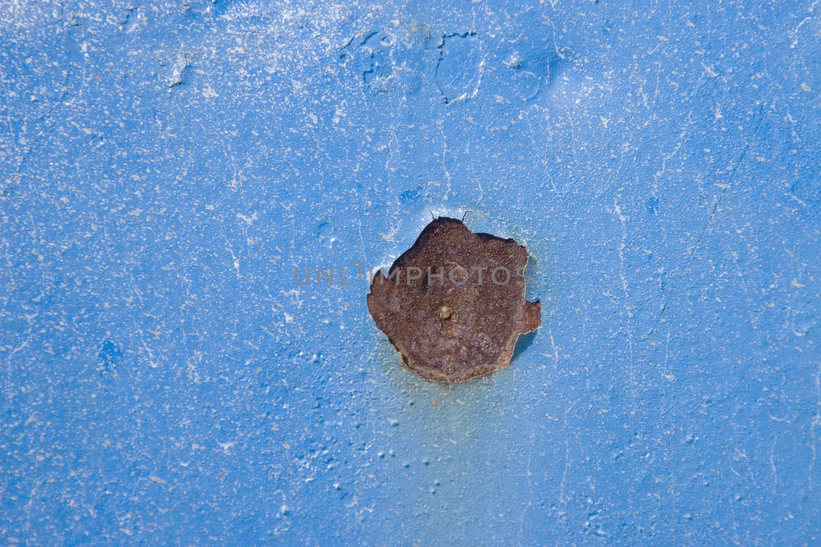 blue surface of an old fence, rusty textures