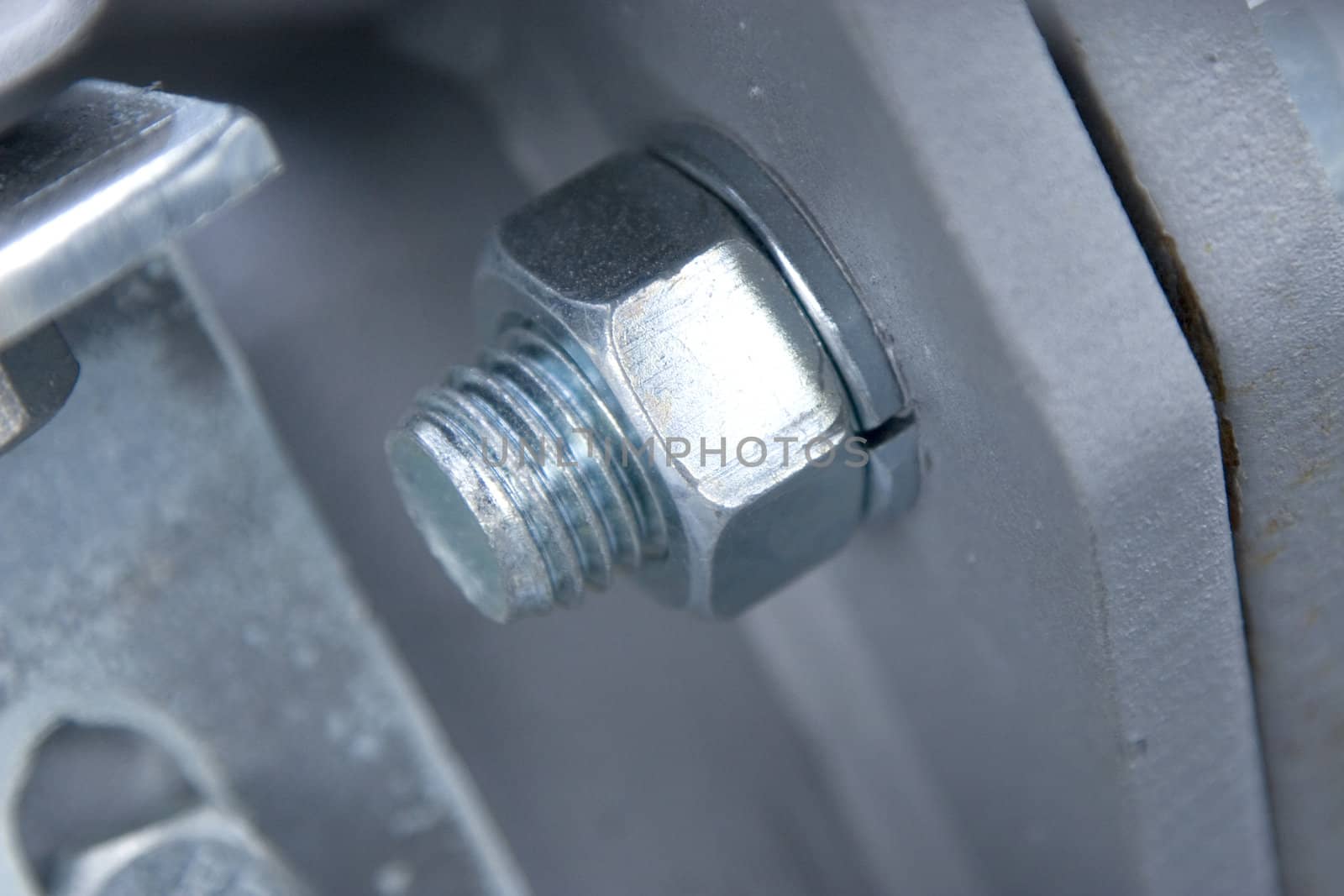 macro of nut and screw, detail from metallic construction