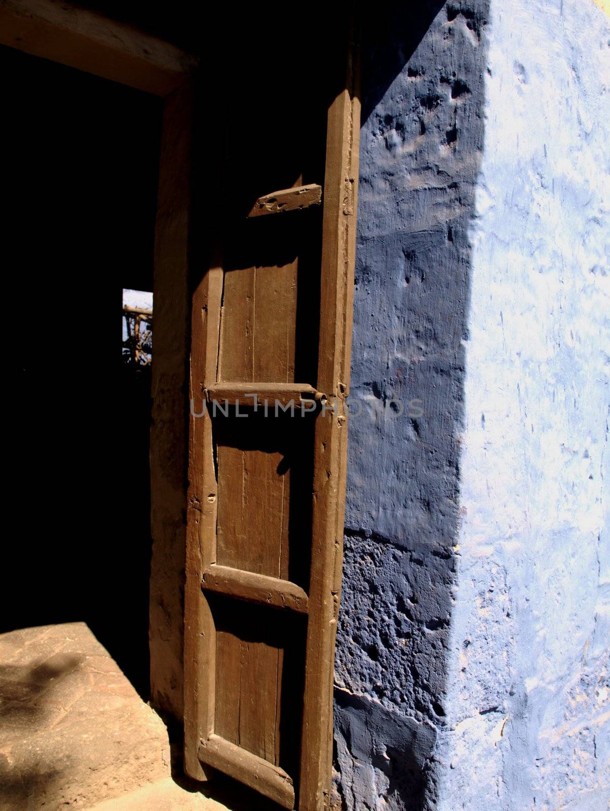 Old, open door in antique monastery