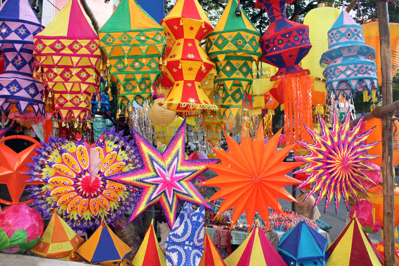 A background of beautiful lanterns in traditional colors and design for Diwali / Christmas festival in India.