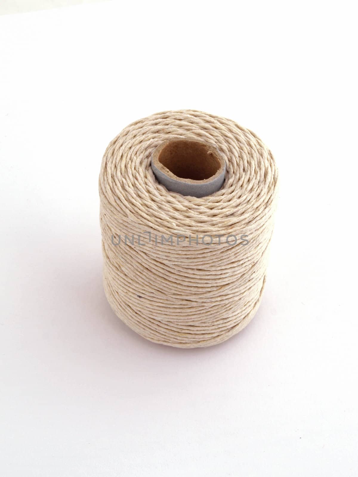 Ball of string or twine on a plain white background.