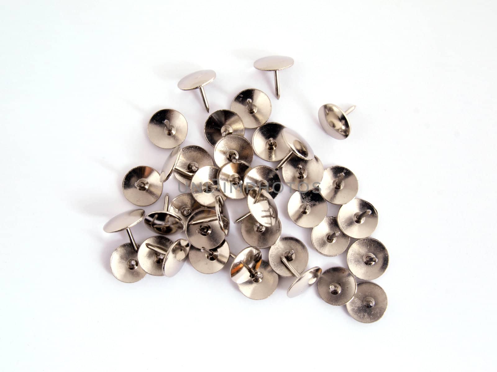 Thumb tack or drawing pin on a plain white background.