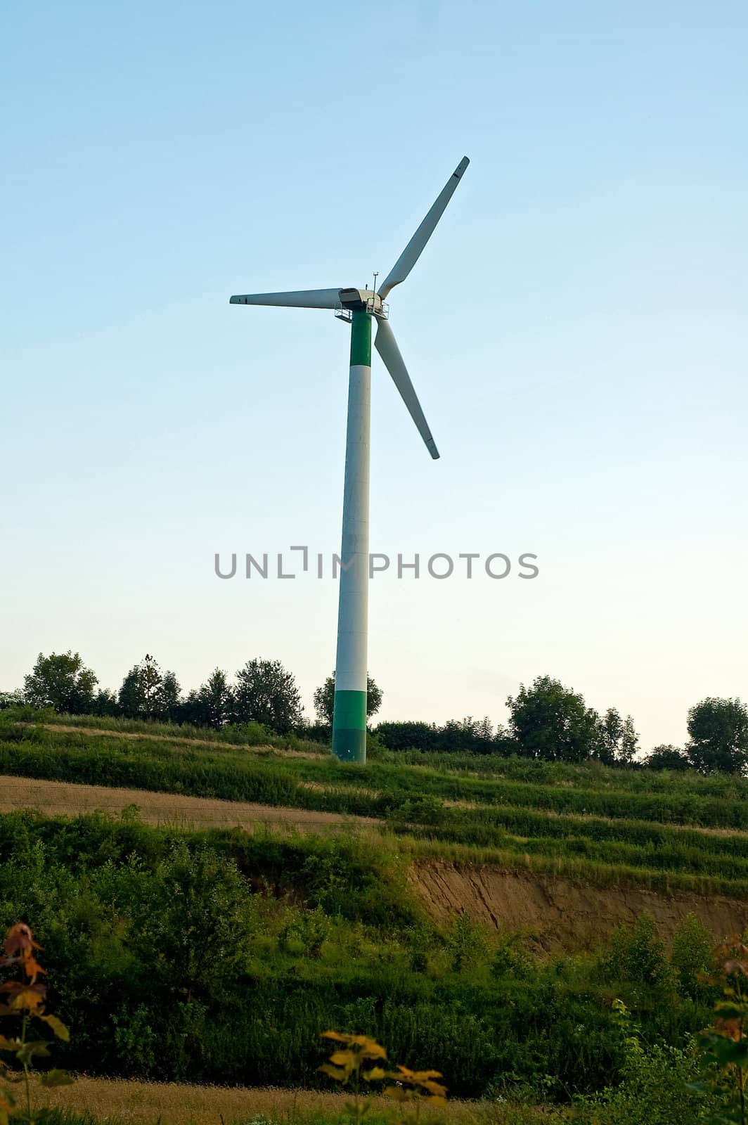 Windmill turning on the sunset