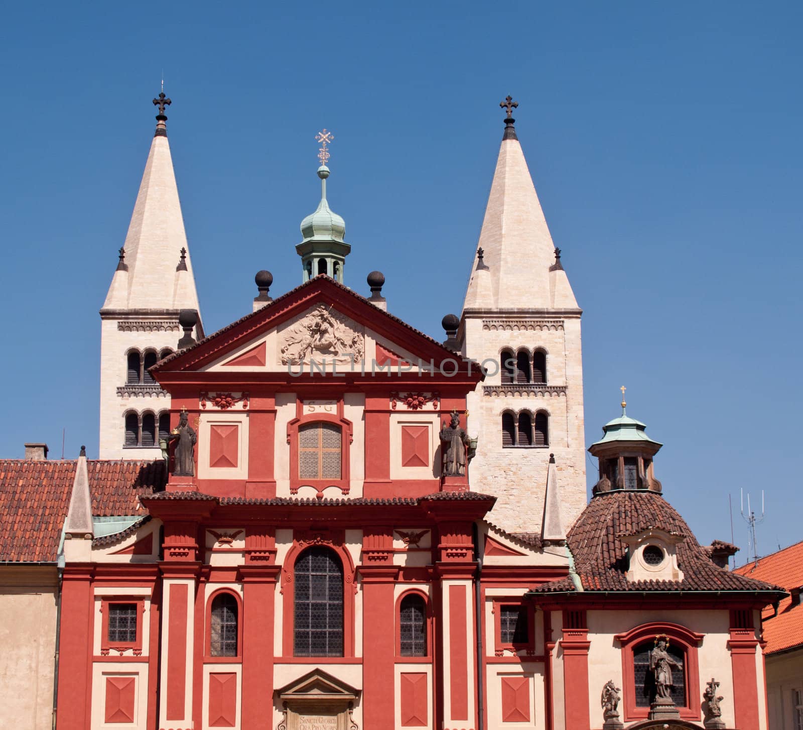 Ancient red painted buildings in main square in Prague