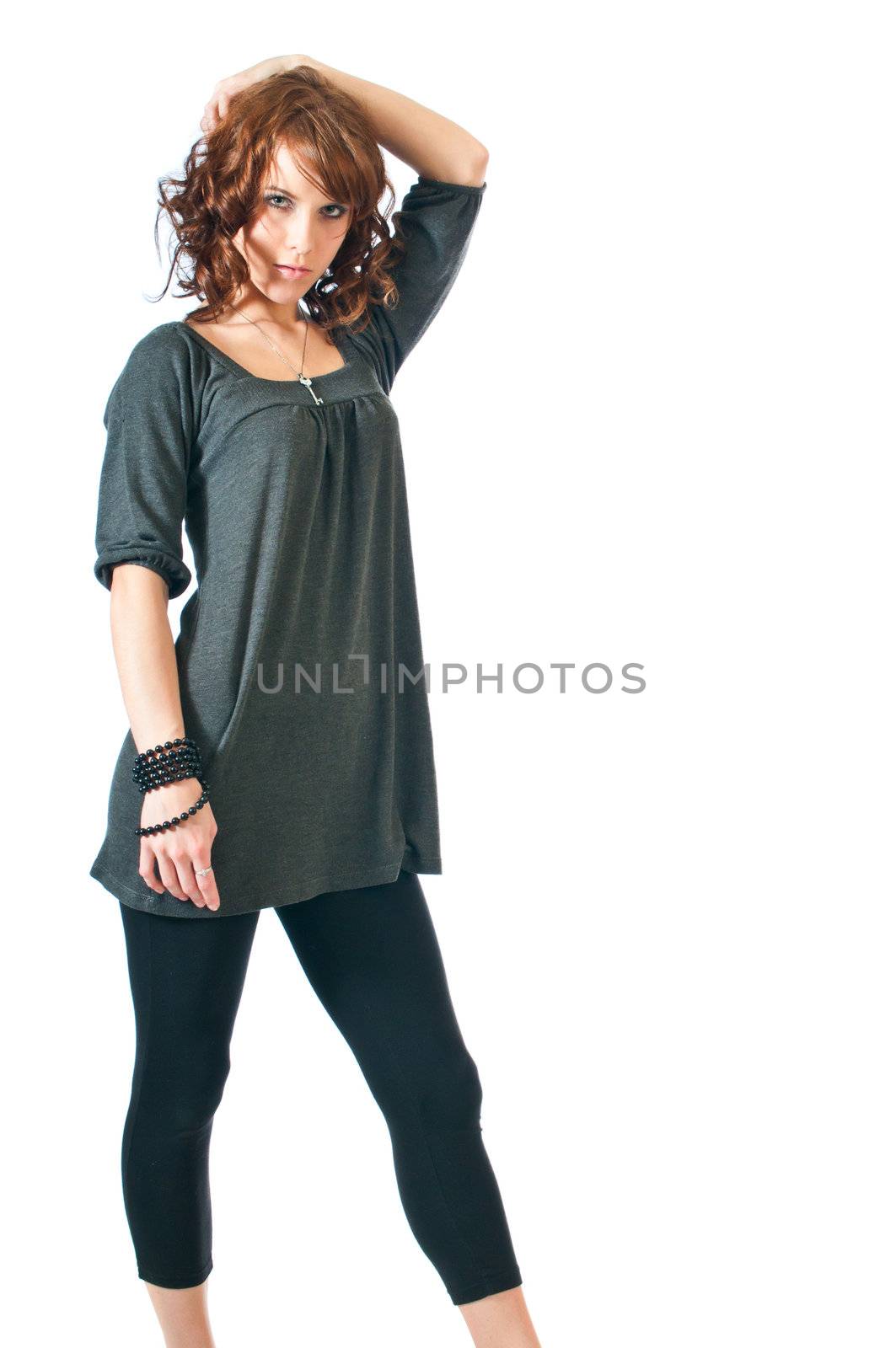 Pretty brunette woman in a sexy pose against a white background.