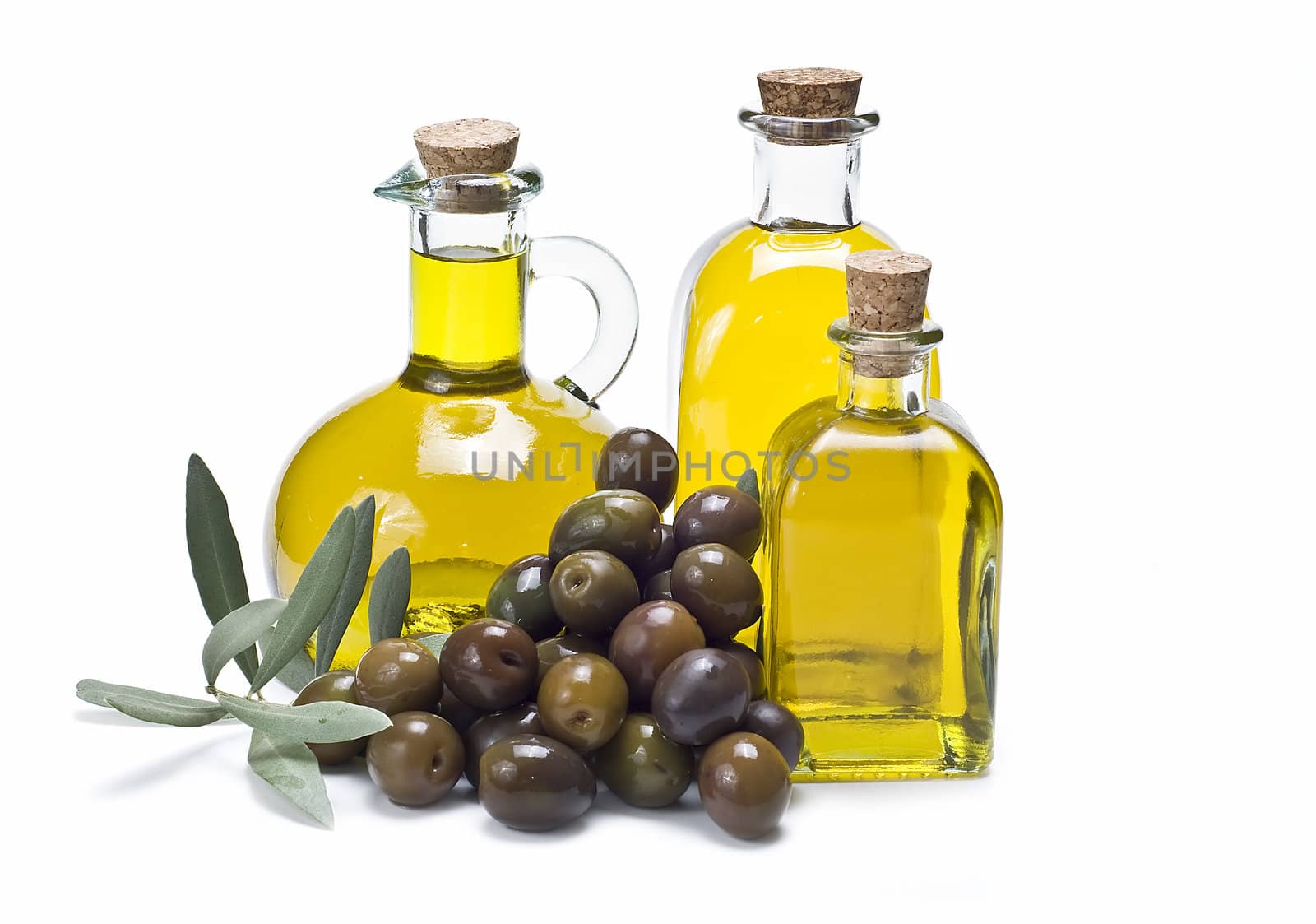 Olive oil bottles and olives isolated on a white background.